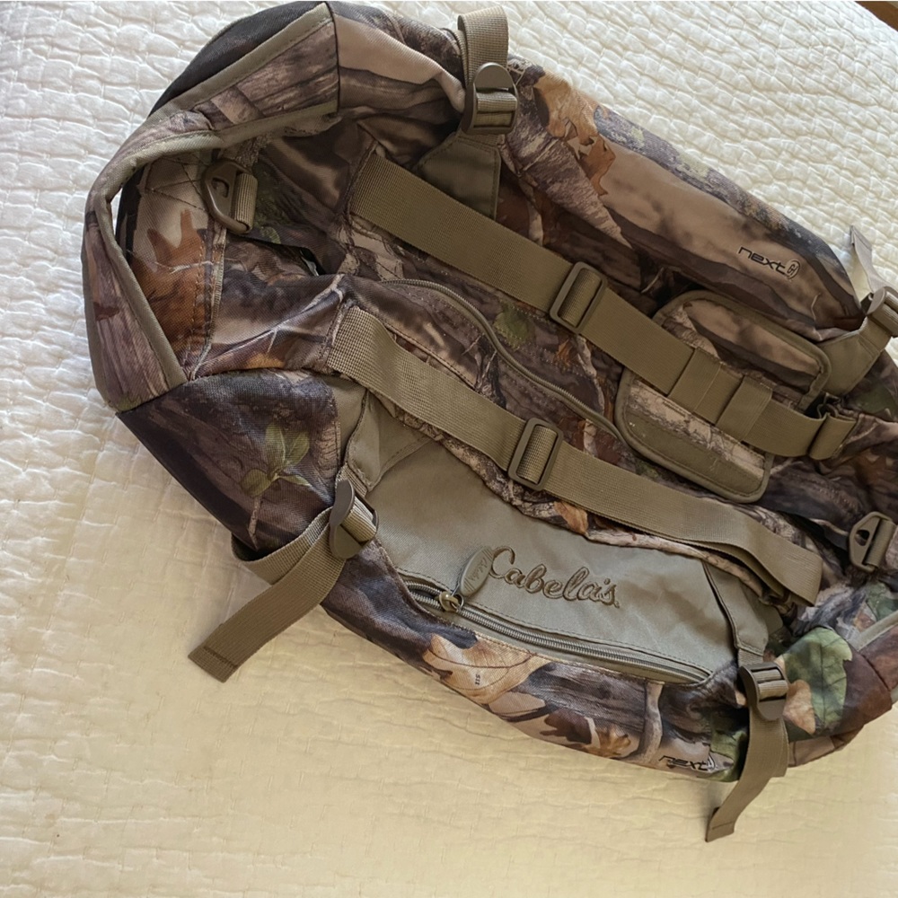 Cabela’s medium size camouflage duffle bag